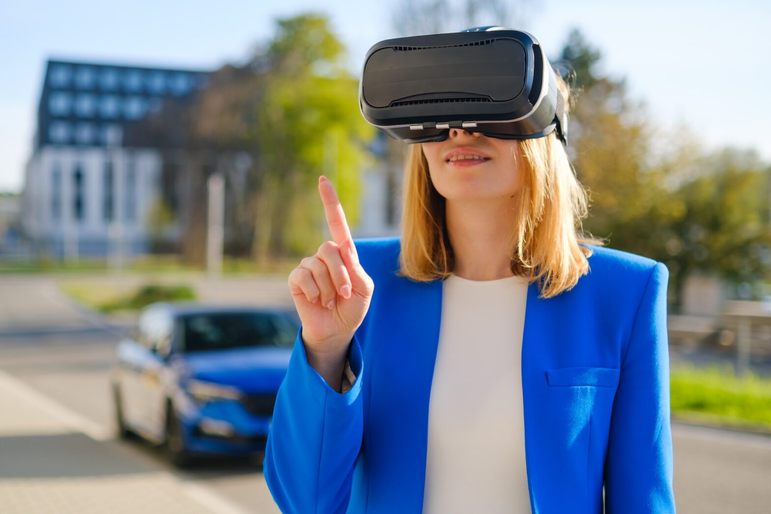 Business woman female wearing VR headset getting experience in metaverse